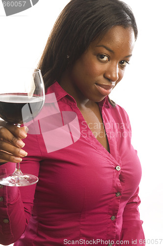 Image of attractive dark hispanic woman toasting with glass of wine