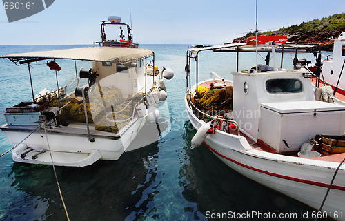 Image of Fishing boats docked at a harbor