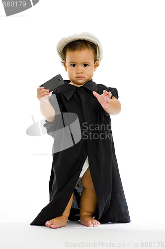 Image of girl with big shirt, hat and mobile phone