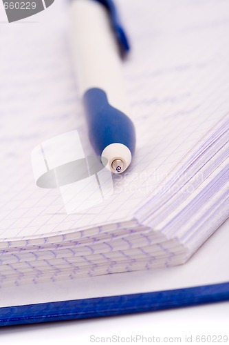 Image of planner with pen
