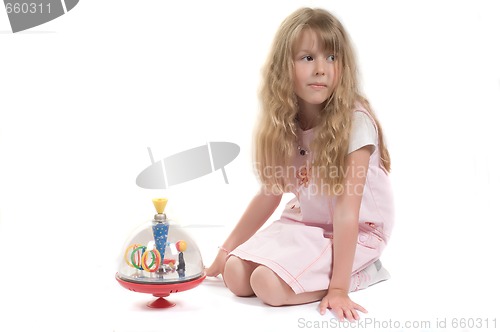 Image of Little girl playing with toy