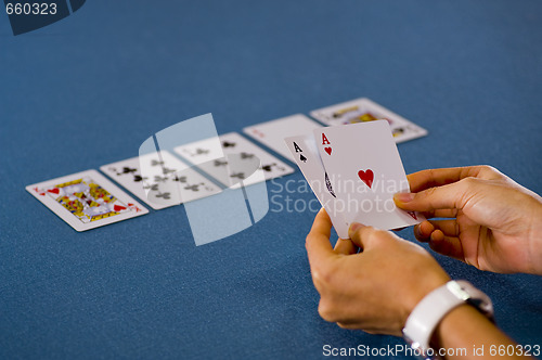 Image of 2 aces in hand