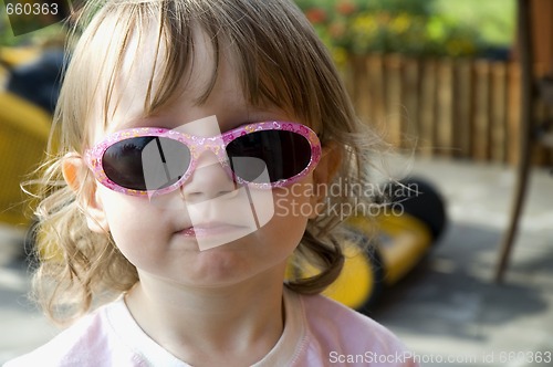 Image of girl wearing funny sunglasses