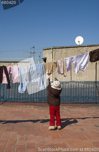 Image of portrait of a sweet girl with the clothesline