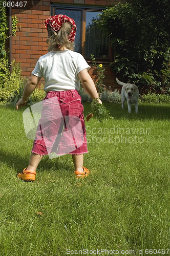 Image of little girl with best friend and carrot