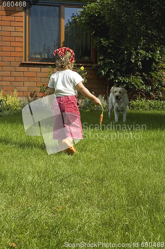 Image of little girl with best friend and carrot