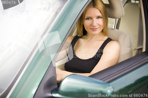 Image of pretty woman in the car