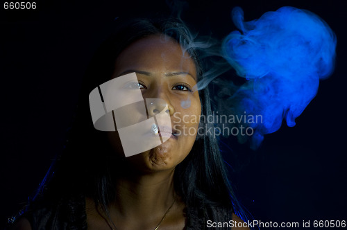 Image of pretty woman smoking