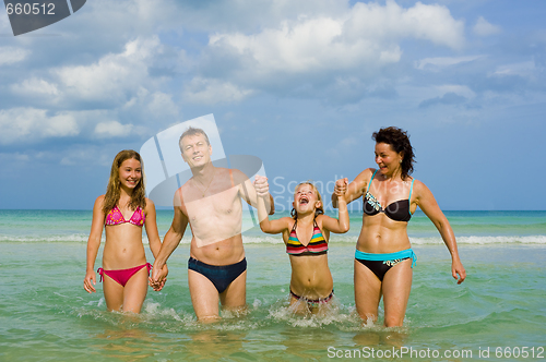 Image of family having fun at the beach