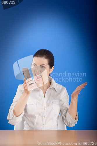 Image of Angry woman calling at phone