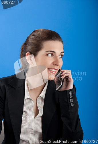 Image of Businesswoman calling at phone