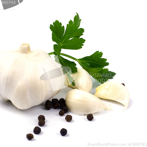 Image of garlics with black pepper and green parsley