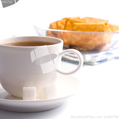 Image of cup of tea, sugar and cookies
