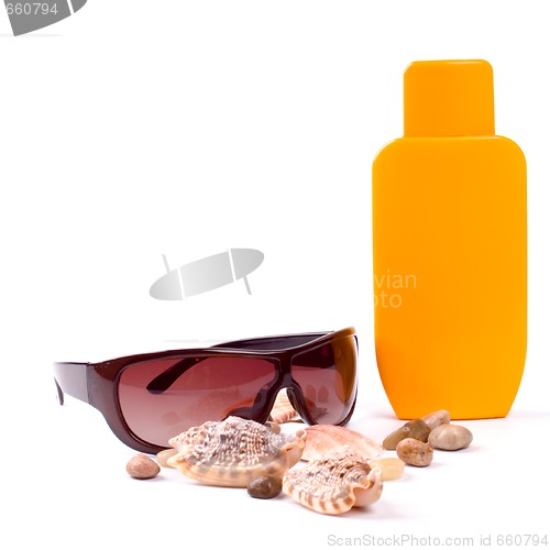 Image of sunglasses and lotion