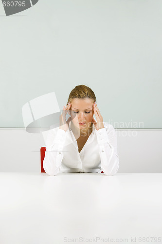 Image of Young businesswoman in stress