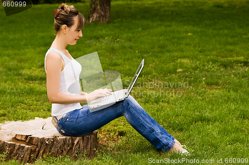 Image of Young woman on the stub with notebook