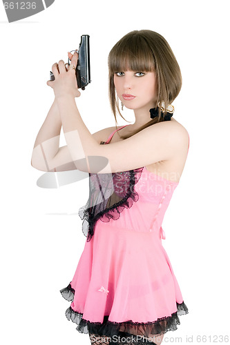 Image of Pretty girl in a pink dress with pistol