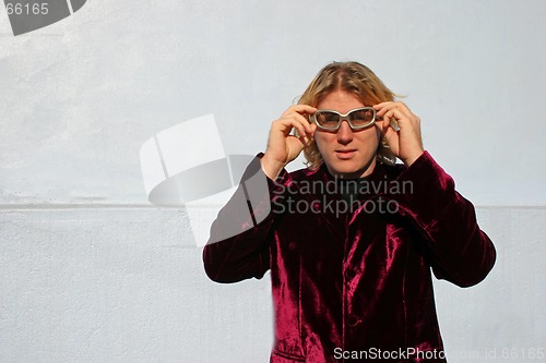 Image of Man adjusting his shades