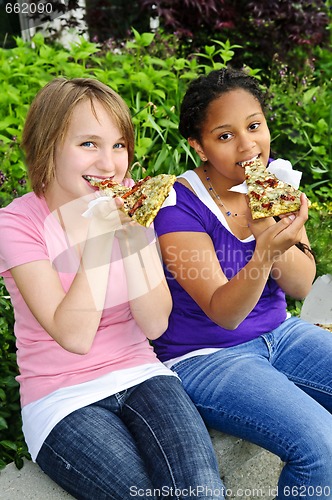 Image of Girls eating pizza