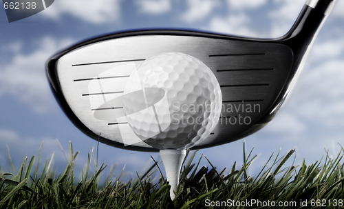 Image of Golf club and ball in grass