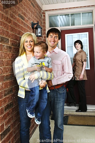 Image of Happy family with real estate agent