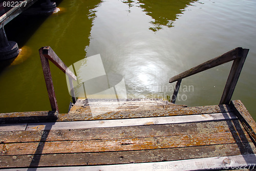 Image of Wooden stairs into water