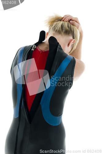 Image of middle age female tri-athlete in swimming wet suit