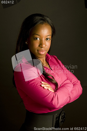 Image of serious hispanic young business woman