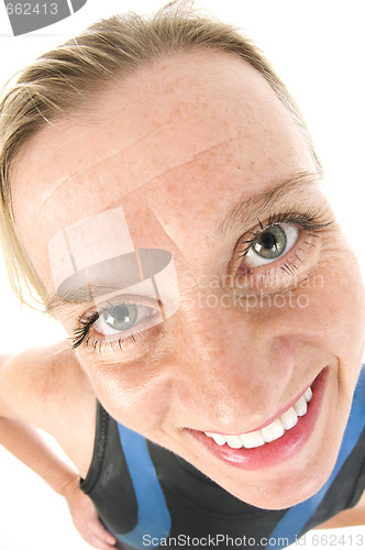 Image of middle age female tri-athlete in swimming wet suit