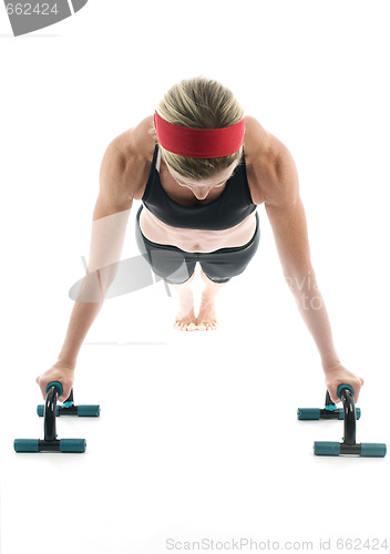 Image of   woman exercising doing push up with fitness push up bar front 