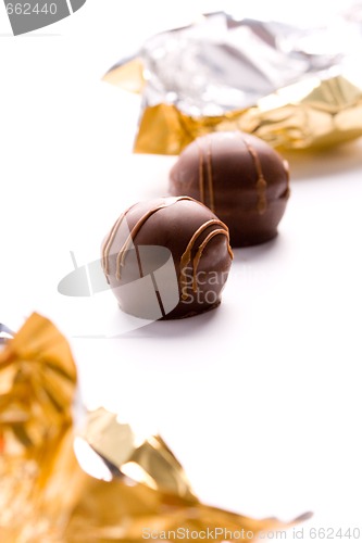 Image of two foil opened sweets