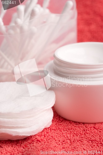 Image of facial cream and cotton pads