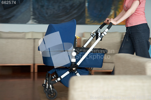 Image of woman indoor with a stroller
