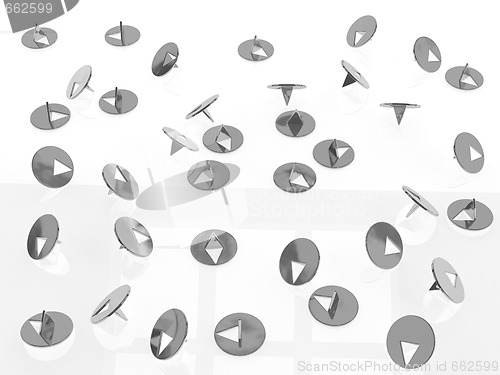 Image of metallic thumbtacks (drawing pins) on white background