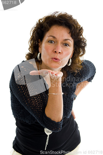 Image of mature woman sending a kiss