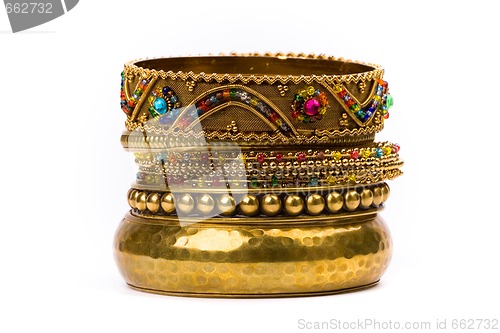 Image of stack of golden bracelets