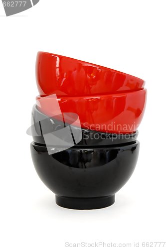 Image of Zigzag stack of two red and two black porcelain bowls isolated