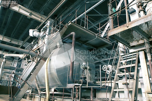 Image of different size and shaped pipes at a power plant