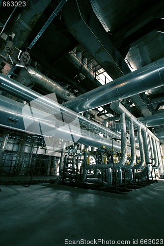 Image of different size and shaped pipes at a power plant