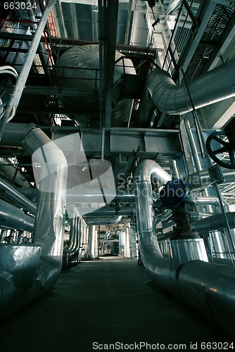 Image of different size and shaped pipes at a power plant