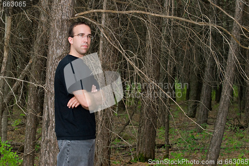 Image of Man Standing In The Forest