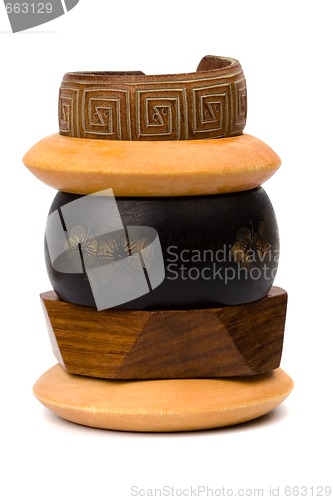 Image of stack of wooden and leather bracelets