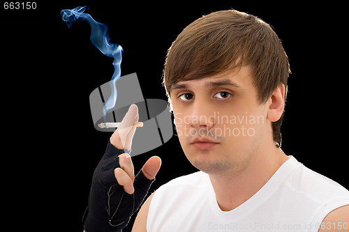 Image of Portrait of the young man with a cigarette. Isolated