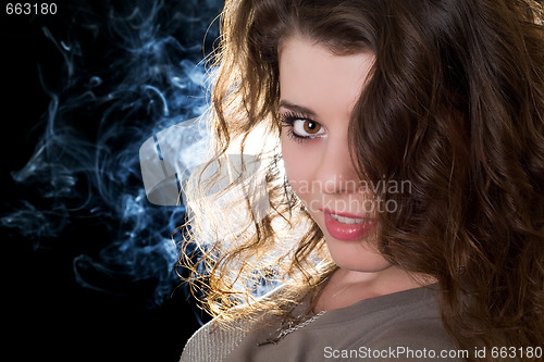 Image of Portrait of the lovely girl. Isolated on black background
