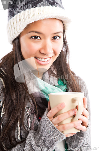 Image of Beautiful asian woman drinking coffee