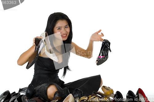 Image of beautiful woman sitting with her shoes