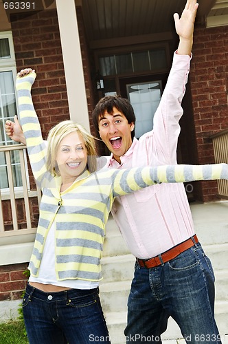 Image of Excited couple at home