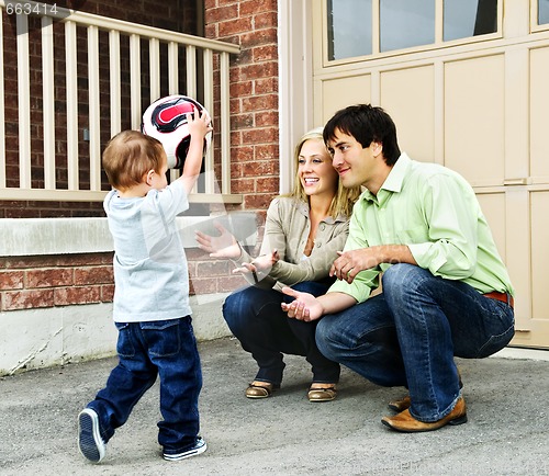 Image of Family playing with soccer ball