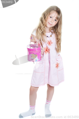 Image of Little girl playing with bag