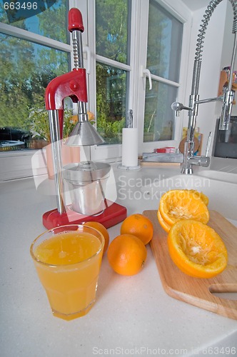 Image of Oranges on red modern kitchen